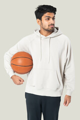 Indian basketball player in a white hoodie men's apparel photoshoot