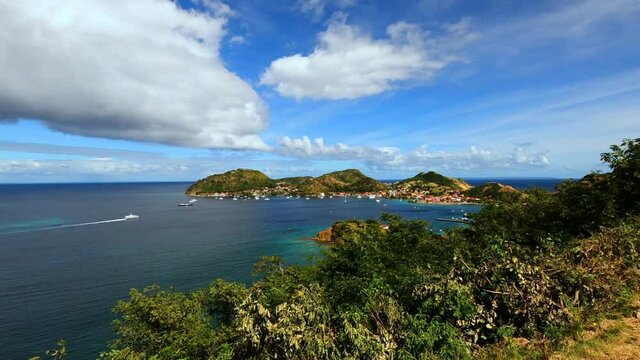 Island Terre-de-Haut, Iles des Saintes, Les Saintes, Guadeloupe, Lesser Antilles, Caribbean. Ilet a Cabrit in foreground, Island Basse-Terre in background.