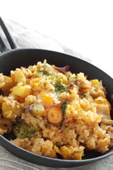 Korean food, spicy octopus fried rice in skillet pan