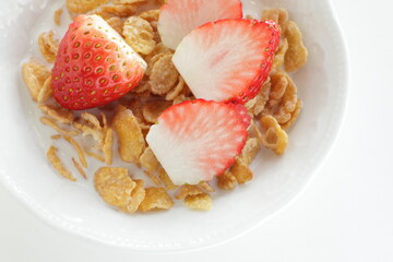 freshness sliced strawberries and corn flakes