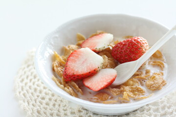 freshness sliced strawberries and corn flakes