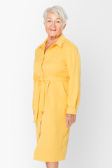Senior woman in yellow shirt dress apparel with design space