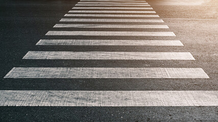 crosswalk on the road for safety when people walking cross the street, Pedestrian crossing on a repaired asphalt road, Crosswalk on the street for safety, logistic import export and transport industry - obrazy, fototapety, plakaty