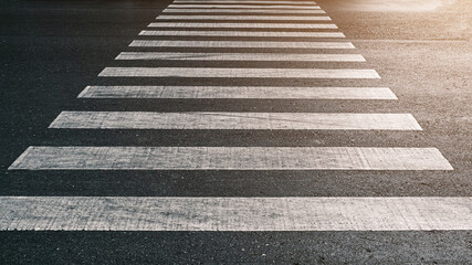 crosswalk on the road for safety when people walking cross the street, Pedestrian crossing on a repaired asphalt road, Crosswalk on the street for safety, logistic import export and transport industry