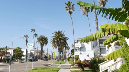 Houses on suburban street in California USA, Oceanside. Generic buildings in residential district...