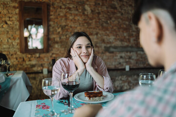 Young pretty woman in love looking at her partner.