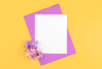 Creative flowers flat lay mockup, floral background with blank white card, copy space
