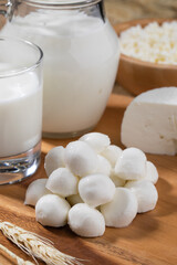 Different white cheese on wooden stand.Concept for Shavuot holiday.