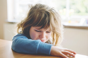 Cute upset unhappy toddler girl crying. Angry emotional child shouting. Portrait of kid with tears. Lonely child due to corona virus covid lockdown.