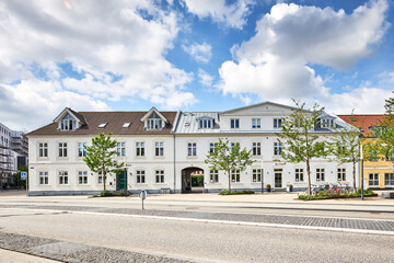 old white building in denmark on main road