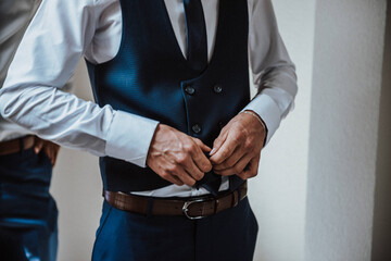 The groom is getting ready for the wedding