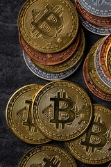 Top view business concept of bitcoin cryptocurrency on dark slate table background.