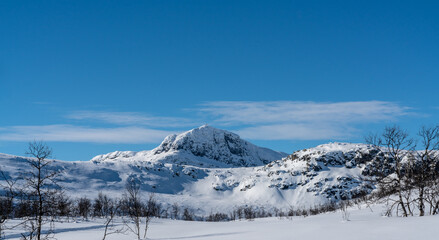 Mount Bitihorn in Norway on a sunny winters day.