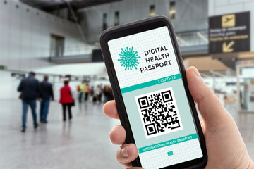 Digital health or Vaccination passport on a mobile phone allowing travel. Covid-19 passport on airport