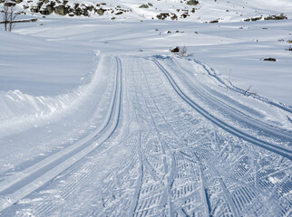Cross country skiing tracks in a Nordic mountain terrain on a cold sunny winters day.