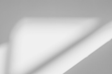 Abstract shadow and striped diagonal light blur background on white wall  from window,  architecture dark gray and sunshine diagonal geometric effect overlay for backdrop and mockup design