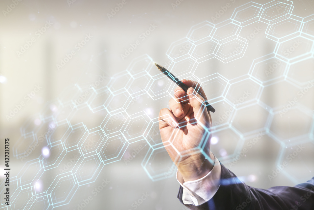 Aufkleber Man hand with pen draws abstract virtual wireless technology hologram with hexagon on blurred office background, artificial intelligence and machine learning concept. Multi exposure