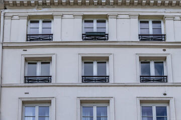 Fototapeta premium Old French house with traditional balconies and windows. Paris, France.