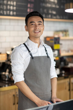 Portrait of coffee shop owner