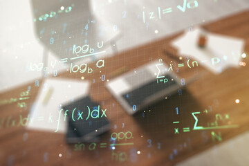 Creative scientific formula hologram and modern desk with computer on background, research concept....