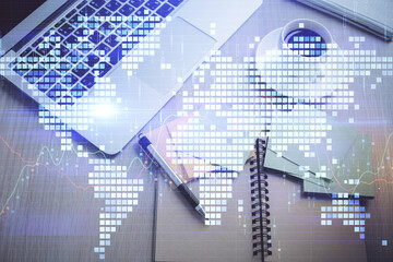 Obraz premium Business theme hologram drawings over computer on the desktop background. Top view. Multi exposure. Concept of international connections.