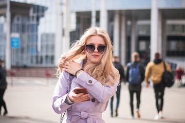 Fototapeta premium Lifestyle concept, a beautiful girl in the city walks