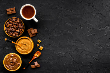 Obraz na płótnie Canvas Background with assorted coffee and cocoa - beans with powder and hot drink