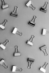 Stationery pattern. Paper binder clips top view