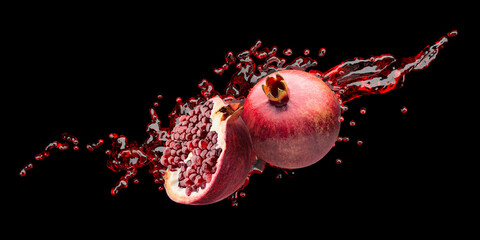 pomegranates with red juice splash on a black background - 427222580