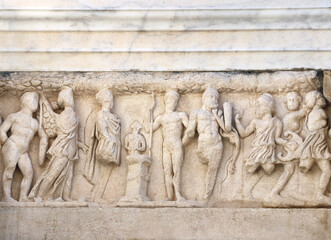 Bas-relief on stone wall of temple in Pergamon, Turkey