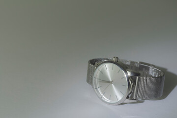 women's wrist watch on a white-gray background. silver