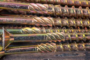 Structural self-tapping screws for Torx 25 bit. Construction abstraction. Industrial background.