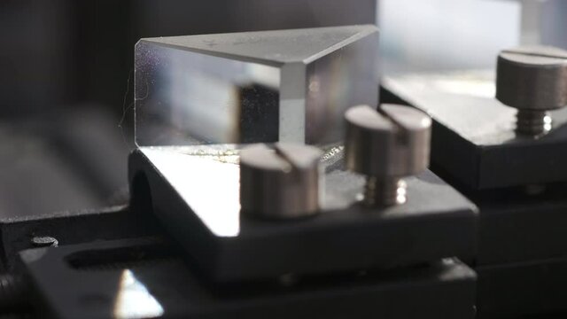 opto mechanical holder close up footage with back tracking camera motion
