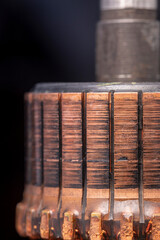 Copper commutator bar of the electric motor close up. Electric motor rotor.