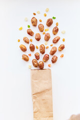 Healthy nutrition concept: dried fruits raisins and dates splash from packets