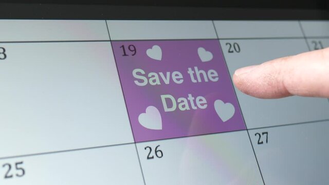 Save The Date Written on Calendar Date as Reminder Closeup