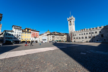 Cathedral Square in Trento downtown (Piazza del Duomo) with the Neptune fountain, Civic tower, Praetorian Palace and the frescoed houses Cazuffi Rella. Trentino Alto Adige, Italy, Europe.