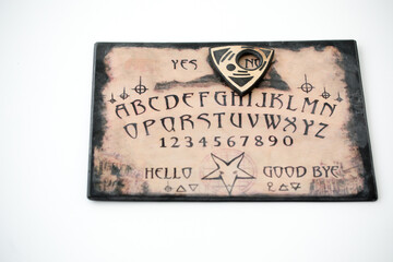 Mystic ritual with Ouija on white background. Devil's board concept, black magic or fortune telling rite with occult and esoteric symbols. Mystical rituals and occult sciences.