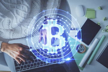 Double exposure of woman hands working on computer and blockchain theme hologram drawing. Top View....