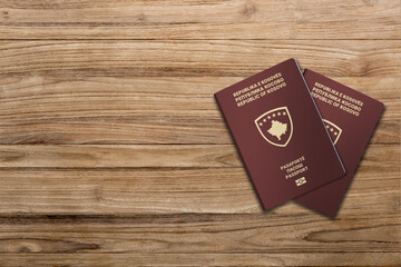 The Kosovar passport is a travel document issued to Kosovar citizens, two passports on a wooden floor
