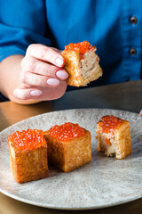 toasts with red caviar, foie gras ganache and fried brioche with red caviar