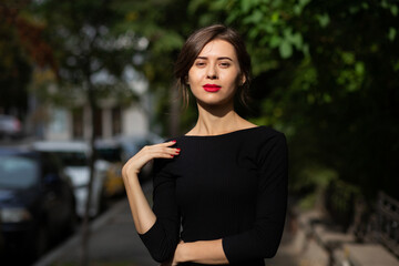 Pretty brunette woman with red lips