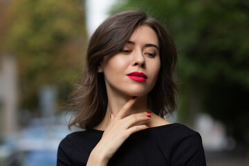 Attractive brunette woman with red lips