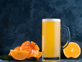 Craft sour beer with orange and tangerine puree, summer refreshing drink