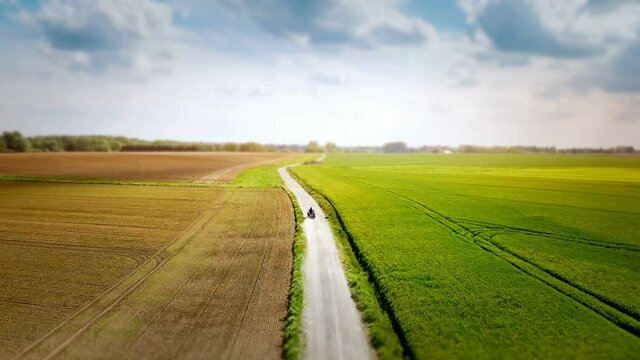 Aerial view of country with quad bike. Nature background, 4K