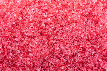 red salt background, crystal texture. bath salt close up flat lay