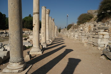 Ancient Roman columns along road in Ephesus city, Turkey.