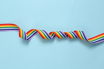 Rainbow lgbt ribbon on blue background