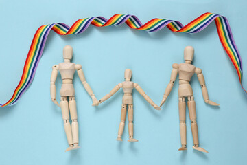 Lgbt family. Marionette family with children on blue background with rainbow ribbon