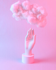 Modern abstract composition of hand and floating fluffy cloud in blue pink neon gradient light. Creative idea. Concept art. Minimalism. Surrealism